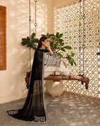 Model wearing Noir Elegance embroidered 3-piece outfit with contrast dupatta