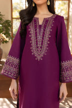 Close-up embroidery detail on plum purple kurta neckline
