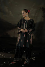 Close-up of floral embroidery on black linen shirt – ZAMARANG