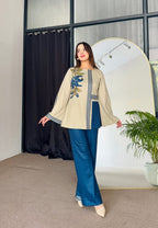 Close-up of floral embroidery with digital stripe design on Korean silk shirt