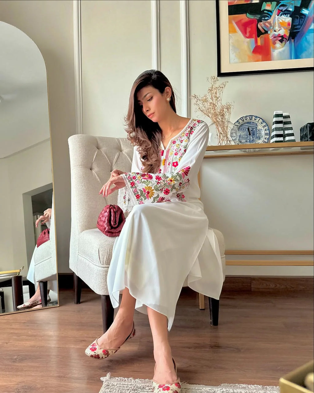 Close-up of multicolor floral embroidery on ivory shirt by ZAMARANG