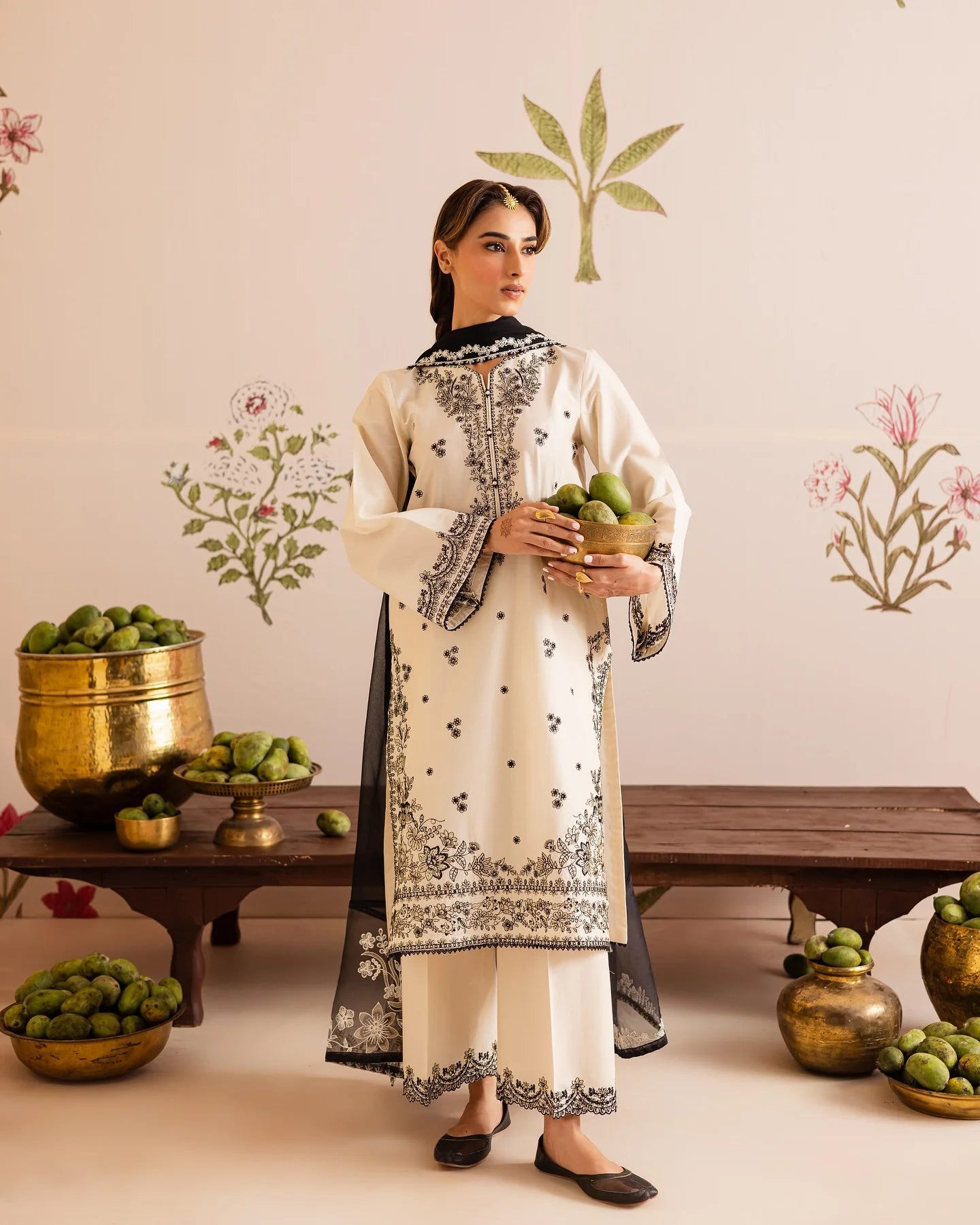 Close up of black embroidery on off white lawn shirt ZAMARANG