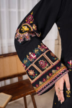 Close up of hand embroidery on Onyx Bloom kurta sleeve and neckline
