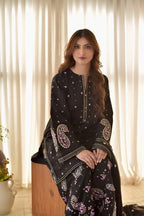 Close up of paisley embroidery on black Arabic lawn kurta neckline