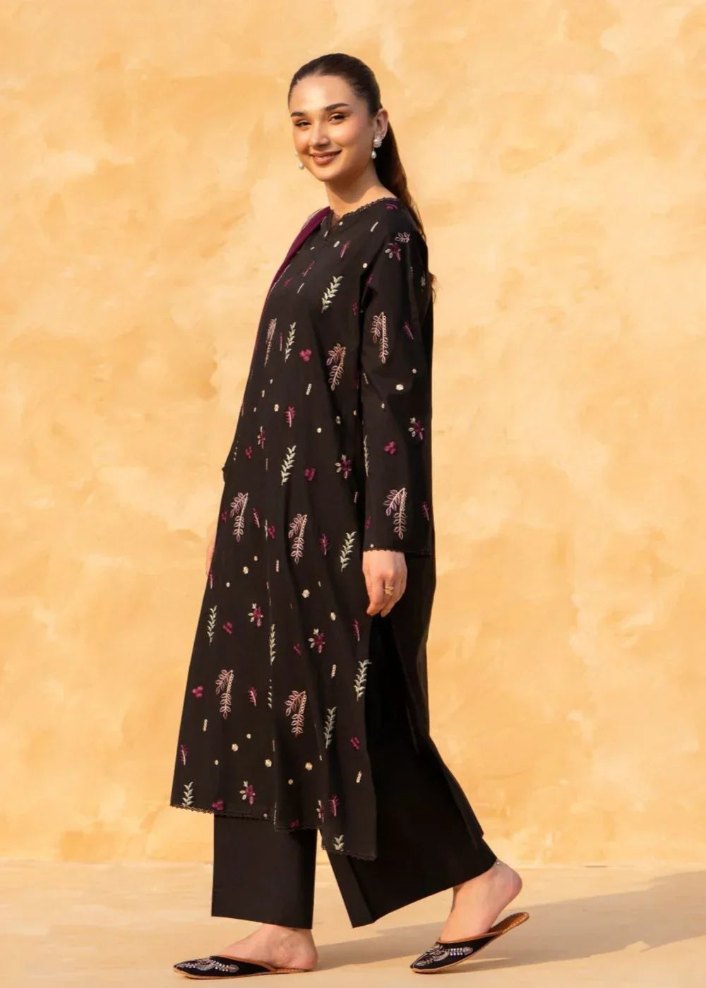 Close-up embroidery on black cotton kurta neckline