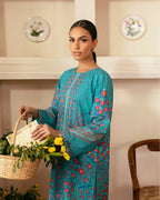 Detailed view of trouser design with floral accents