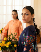 Front view of peach orange shirt with digital floral motifs