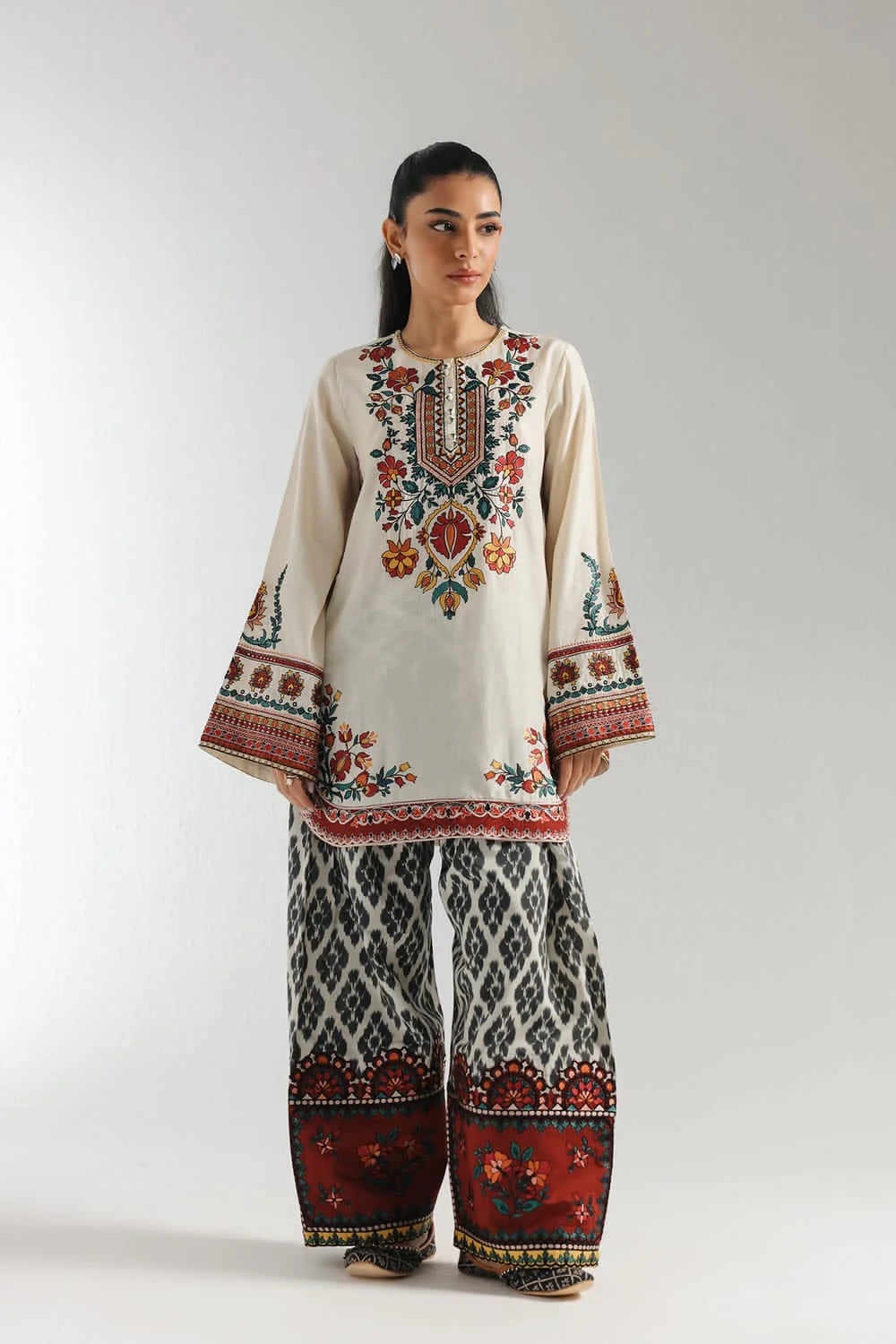 Full front view of ivory and rust 2-piece suit by ZAMARANG