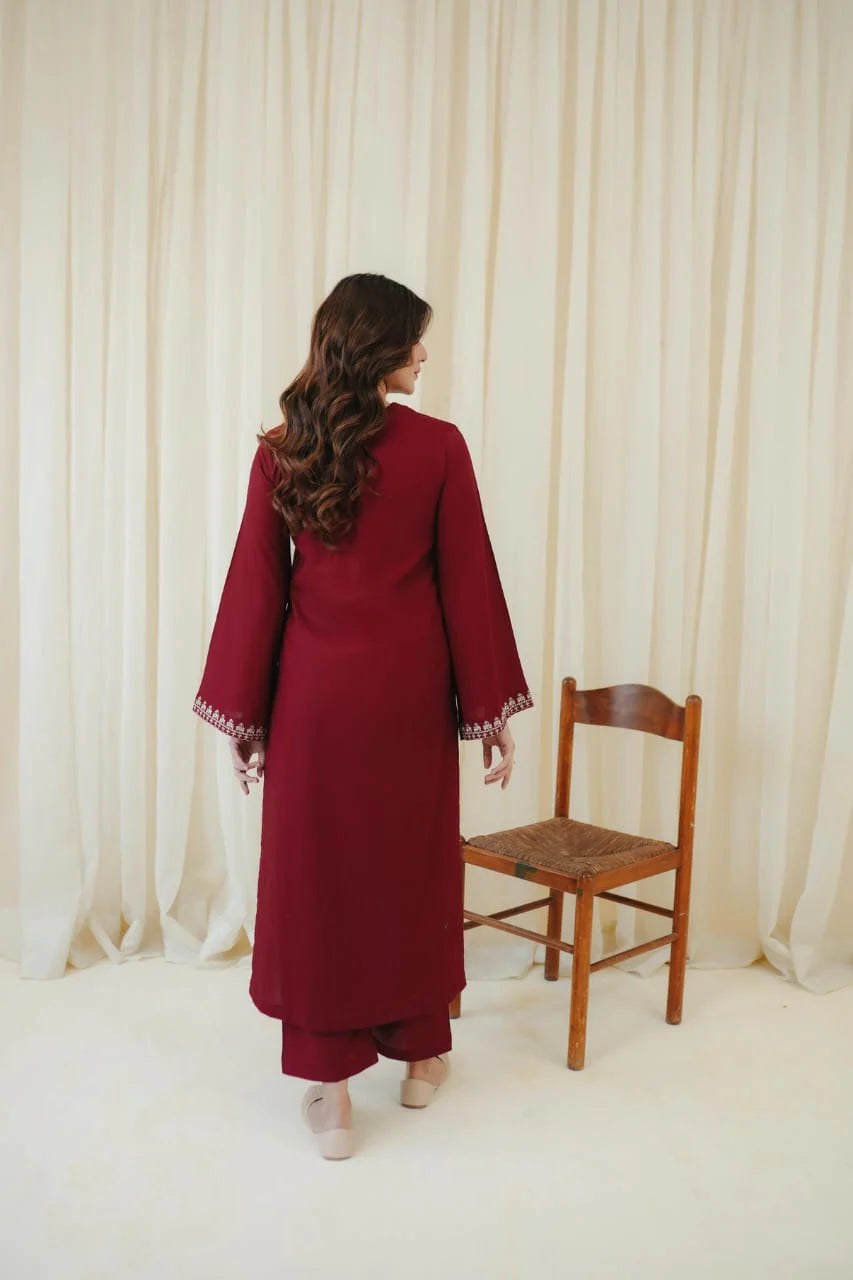 Matching deep burgundy linen trousers with embroidered shirt