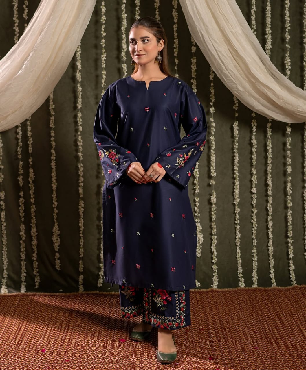 Model wearing Bright Blue embroidered 2 piece stitched linen suit by ZAMARANG