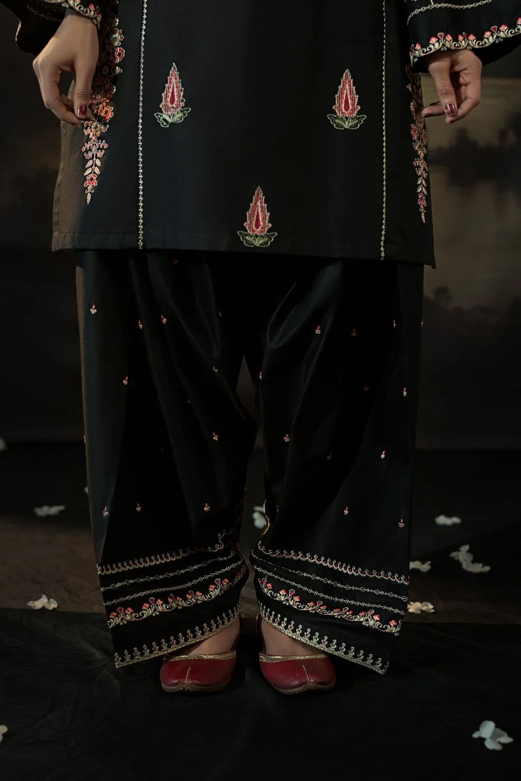 Model wearing black 2-piece embroidered linen suit – festive look