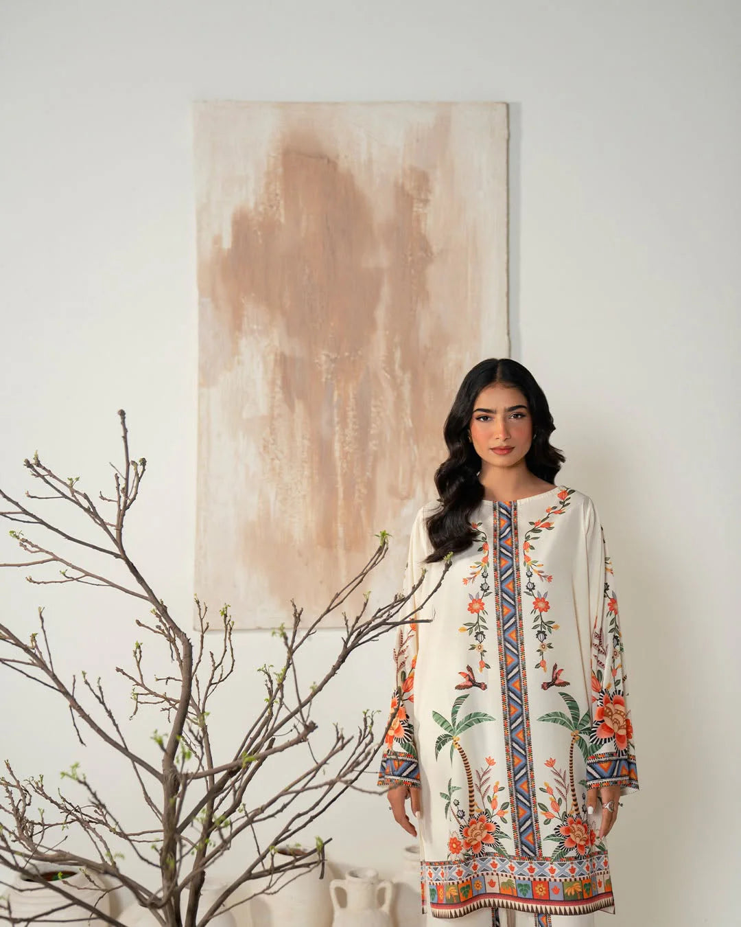 Model wearing cream digital printed stitched 2 piece suit by ZAMARANG