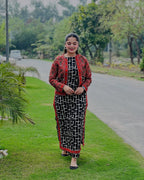 Model wearing digital printed 3 piece suit with red jacket