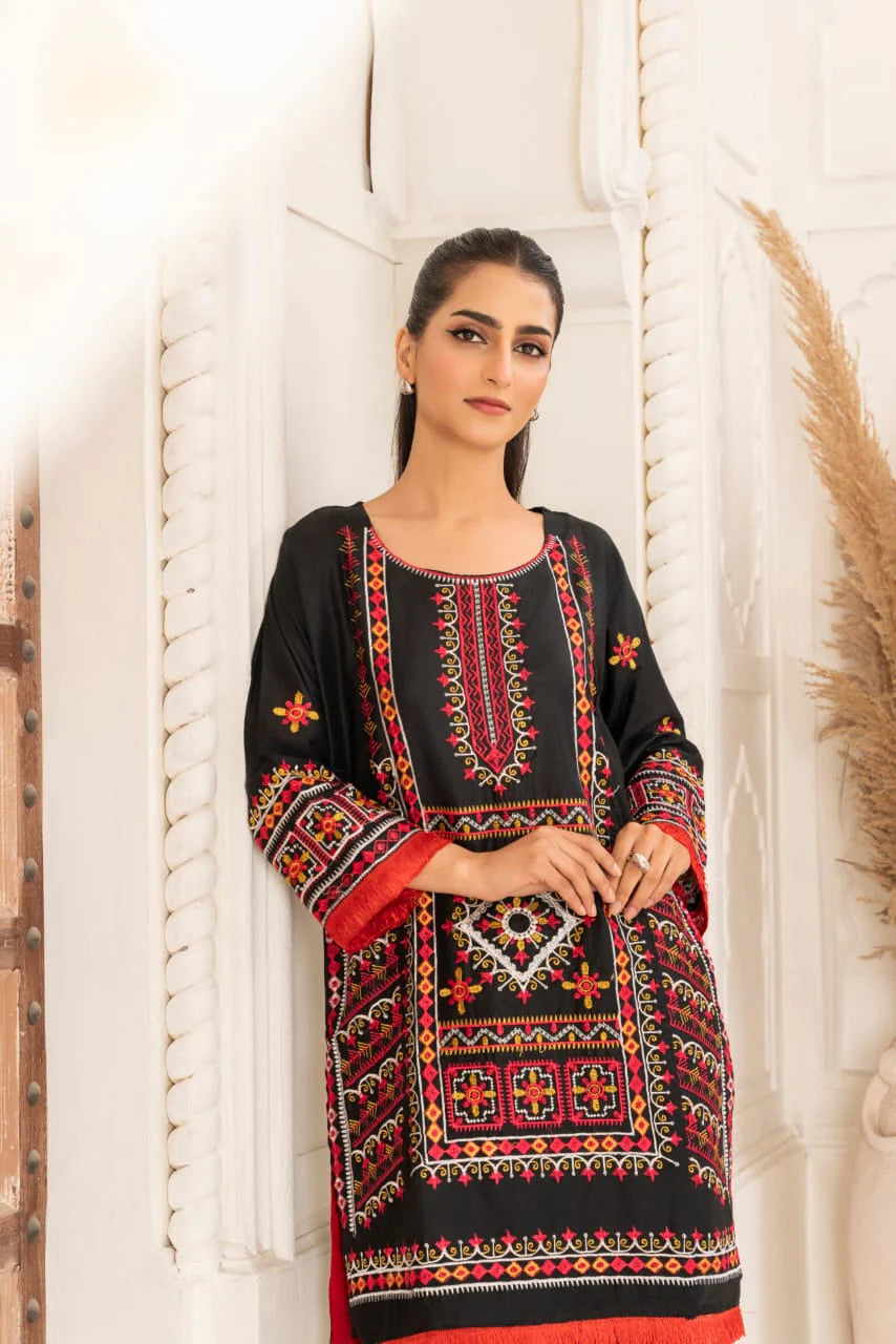 Plain linen trouser paired with embroidered shirt for casual wear