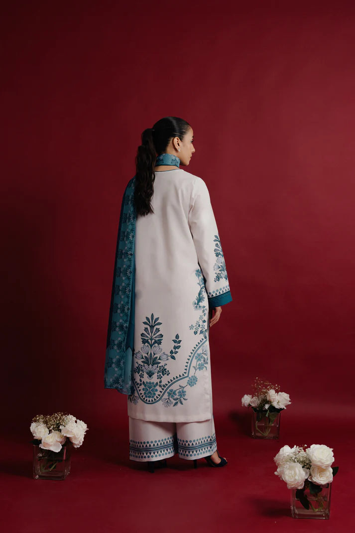 Printed sleeve and hem detail of teal blossom suit