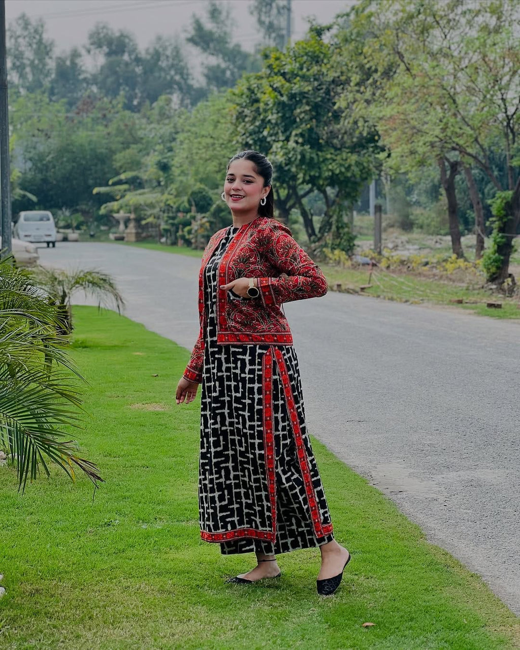 Red ethnic jacket paired with digital black lawn kurta