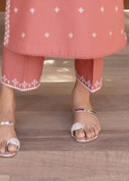 White embroidery close up on rose blush kurta neckline