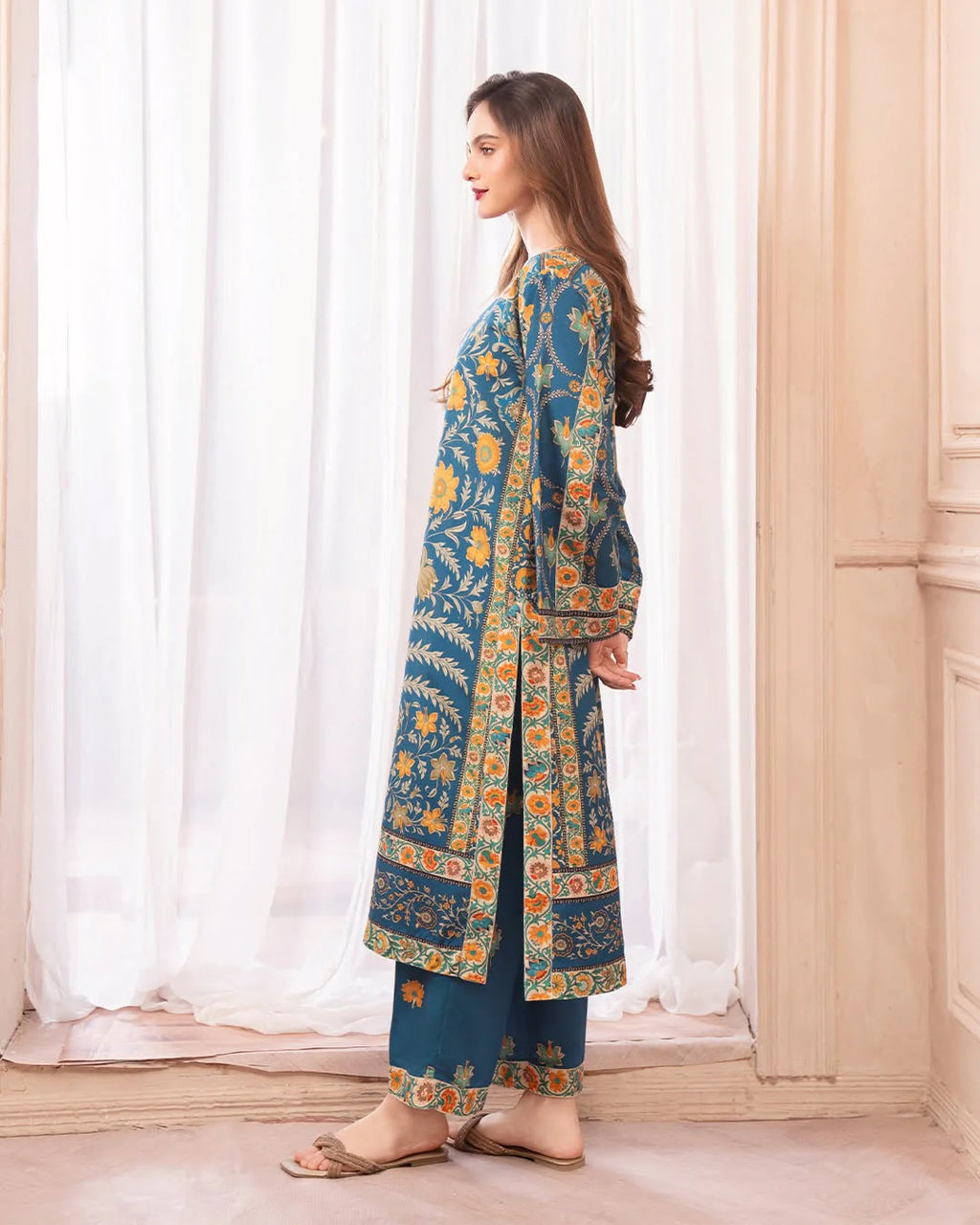 Wide-leg teal blue trousers with printed hem border – ZAMARANG