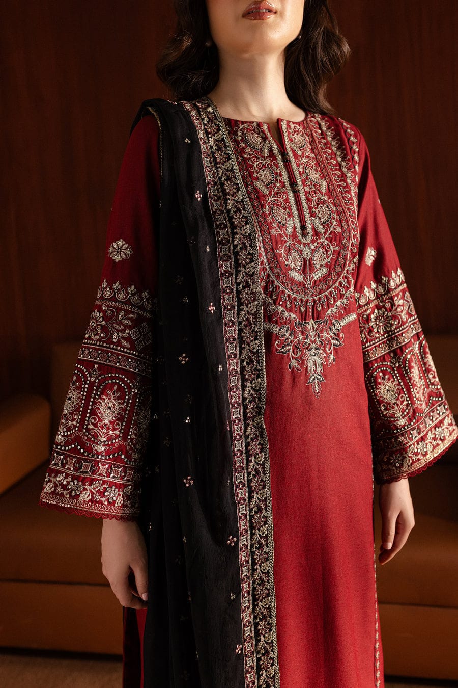 Detailed embroidery on sleeve and hem of crimson lawn kurta