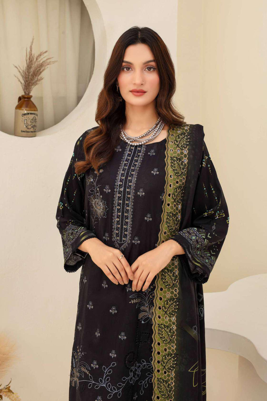 Close up of embroidery on black viscose shirt neckline and hem ZAMARANG