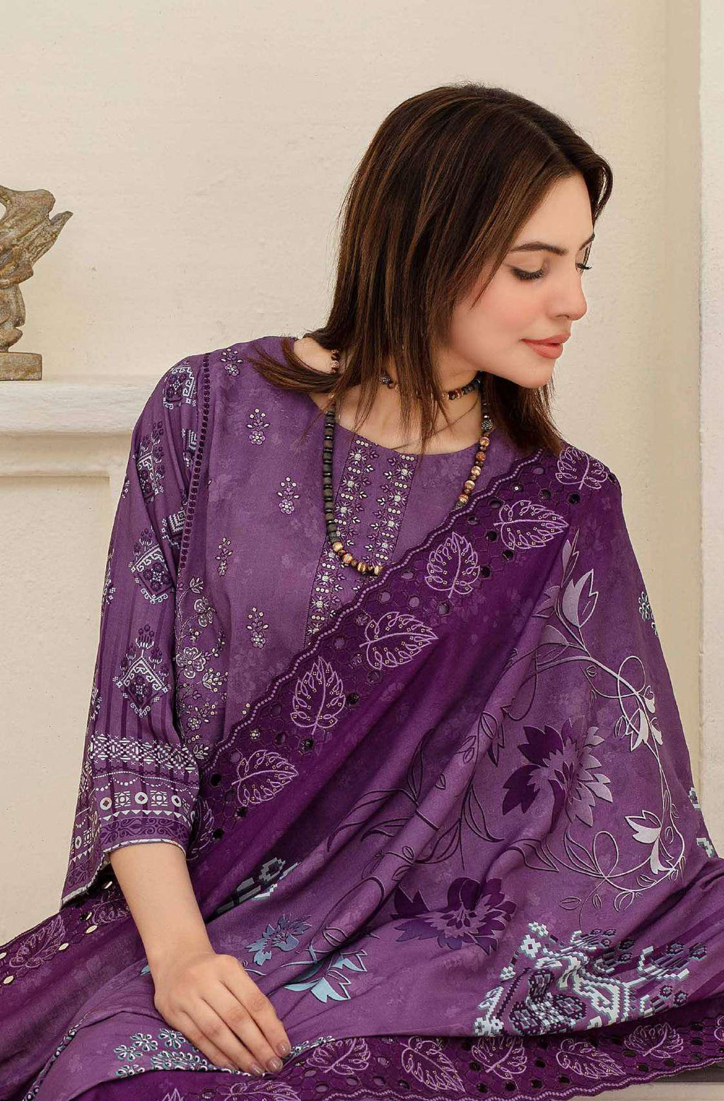 Close-up of embroidery on deep purple viscose shirt