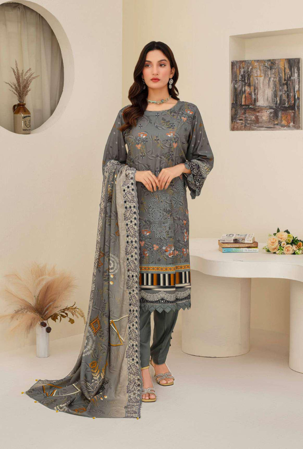 Close-up of grey embroidered shirt detailing and border