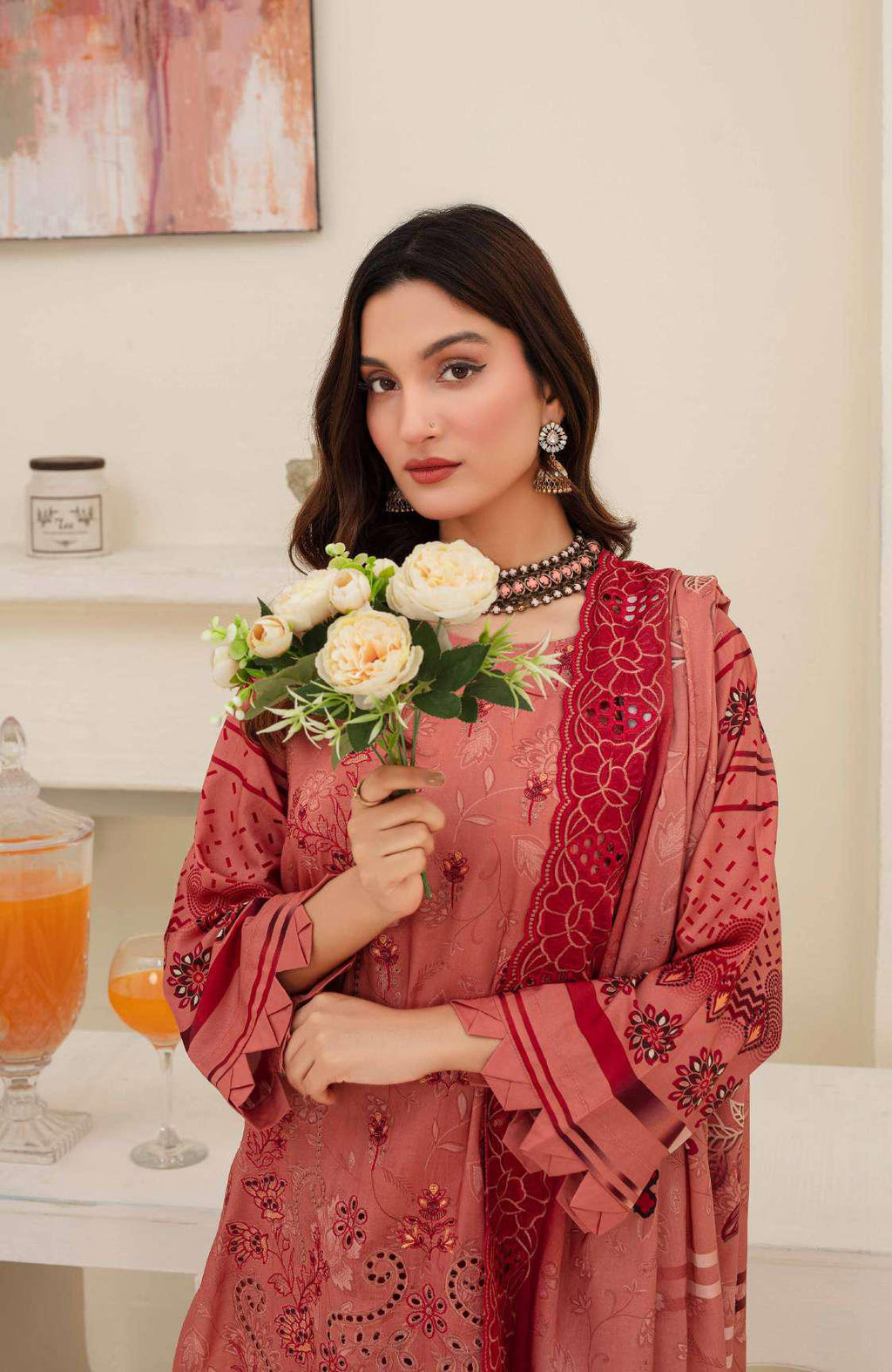 Close up deep red maroon embroidery on dusty rose viscose shirt